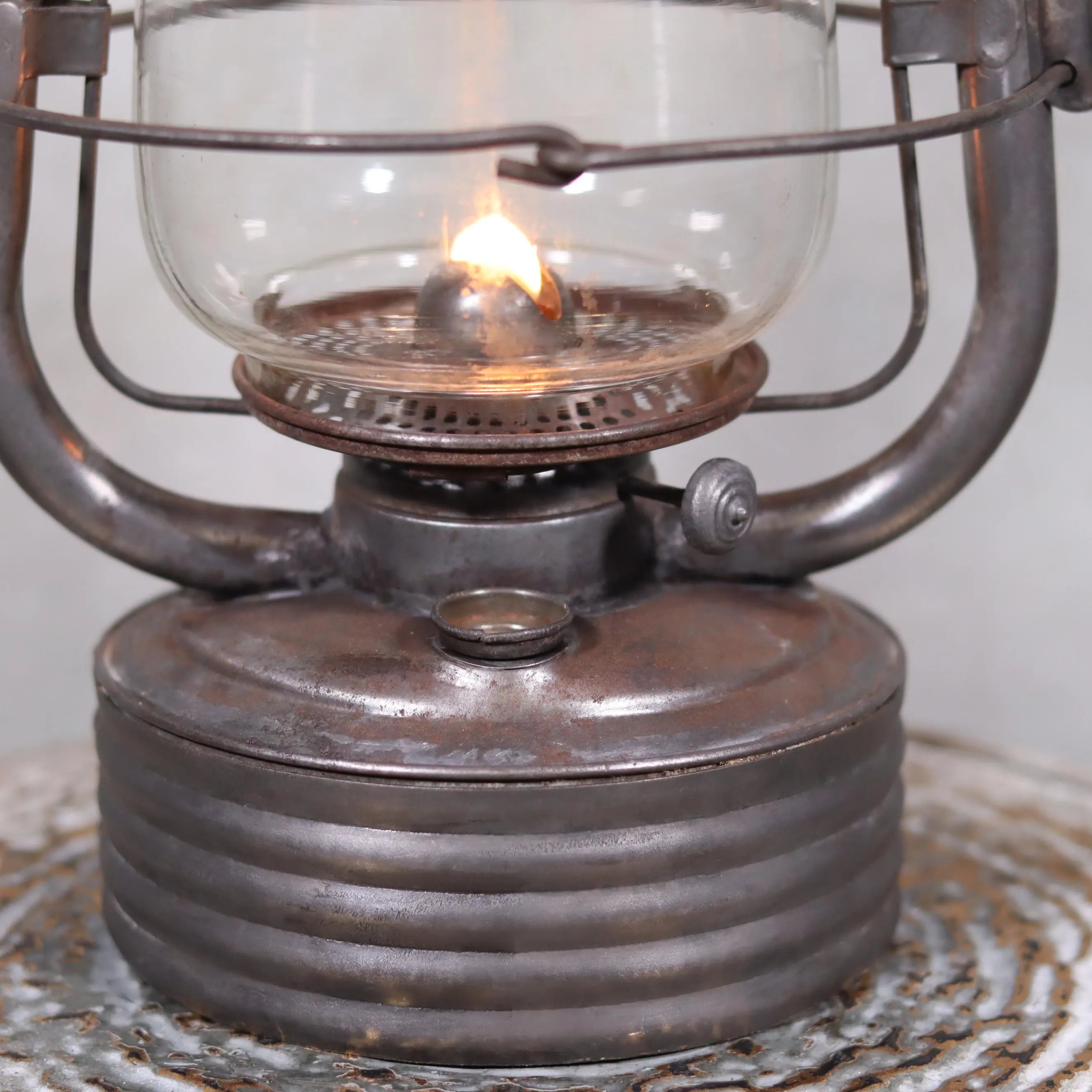 Vintage French Valentini Hurricane Lantern – La Bretonne Model (1950s/60s) oil lamp with lit flame and metal base detail