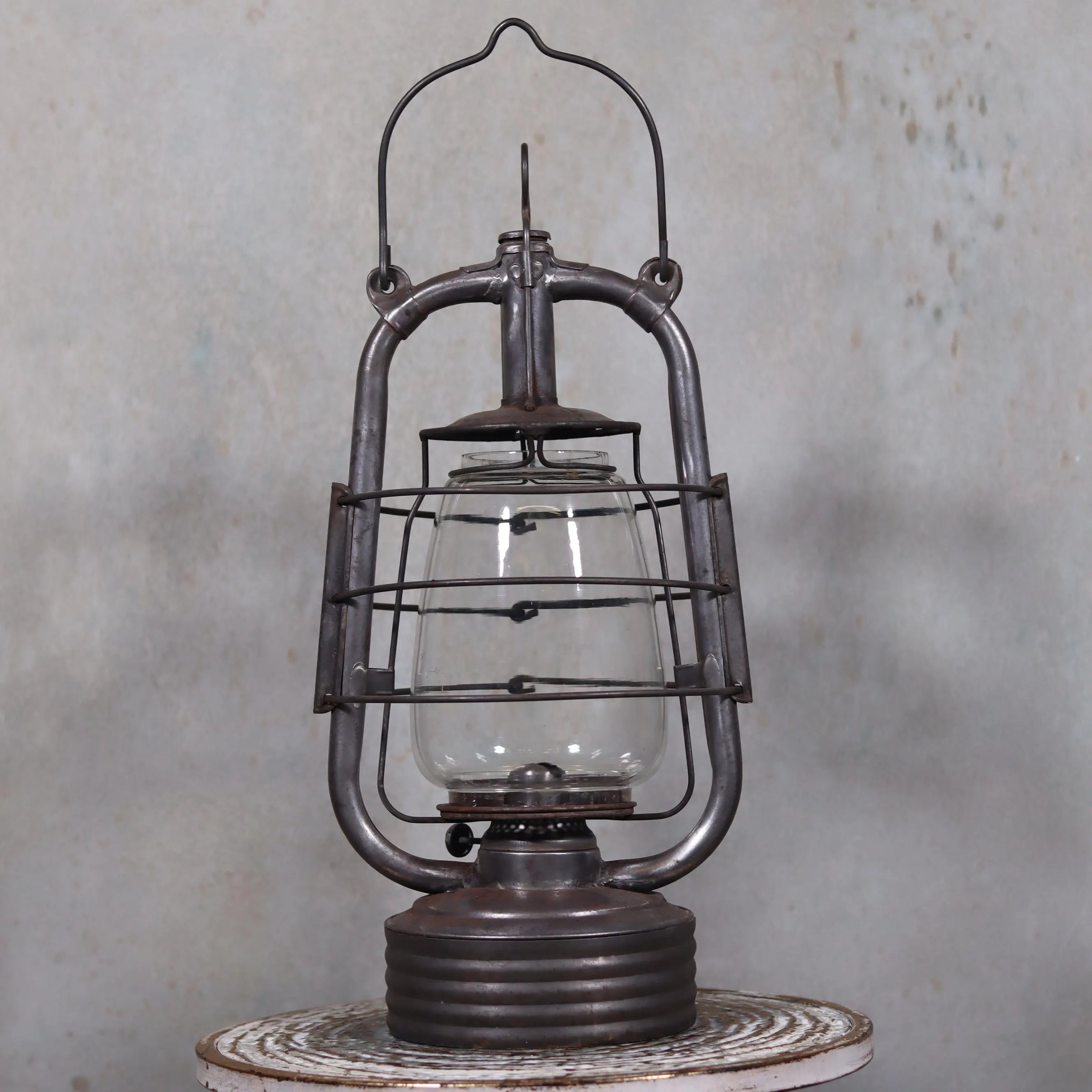 Vintage French Valentini Hurricane Lantern – La Bretonne Model (1950s/60s) oil lamp with protective metal frame and clear glass chimney.